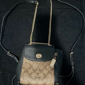 Convertible Coach Backpack into shoulder bag.